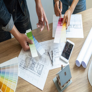 interior designer architect choosing color swatch