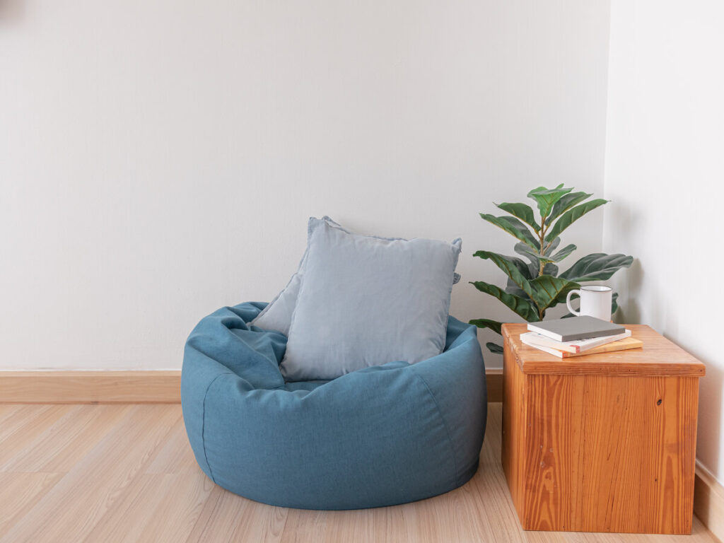 blue bean bag with grey cushion in a living room